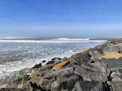a group of rocks on the shore of the ocean at Eco Gare centre 2 chambres in Bouznika