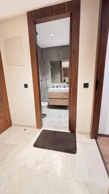 a bathroom with a tub and a large mirror at Hammersmith 11 in Casablanca