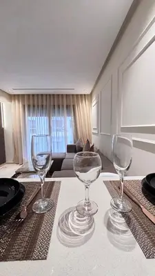 three wine glasses sitting on a table in a living room at Hammersmith 11 in Casablanca