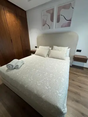a bedroom with a bed with two towels on it at Studio à louer in Casablanca