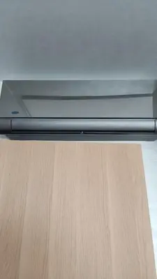 a laptop computer sitting on top of a wooden table at Apartment kamal park G39 in Mohammedia