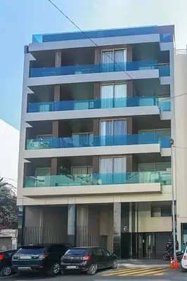 two cars parked in front of a building at Maya Suites - Luxury Stay in Casablanca in Casablanca