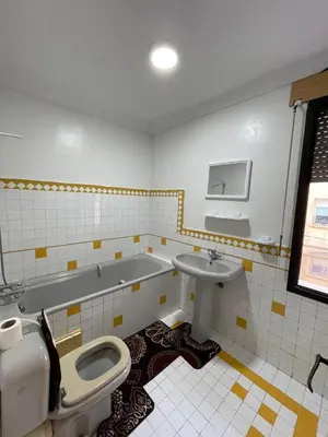 a bathroom with a toilet and a sink at Bd les iris in Casablanca