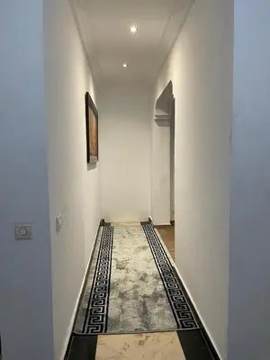 an empty hallway with a black and white floor at Bd les iris in Casablanca