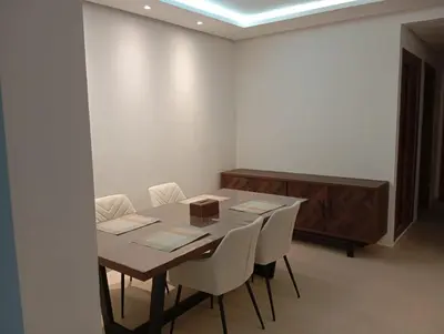 a conference room with a table and chairs and a podium at Ennour in Rabat