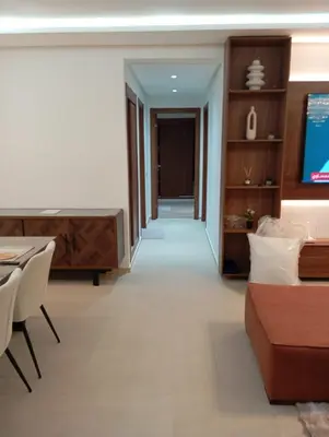 a living room with a couch and a television at Ennour in Rabat