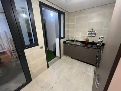 a small bathroom with a sink and a mirror at Appartement dans un cadre convivial in Rabat
