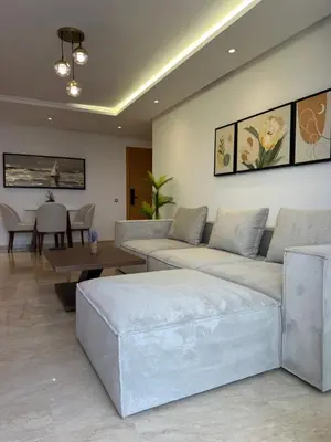 a living room with two couches and a table at Cosy Appartement in Rabat