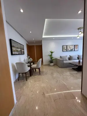 a living room with a couch and a table at Cosy Appartement in Rabat