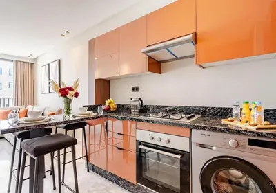 a kitchen with a stove and a dishwasher at Studio Luxe avec vue Magnifique WiFi Haut Debit et Netflix Inclus in Casablanca