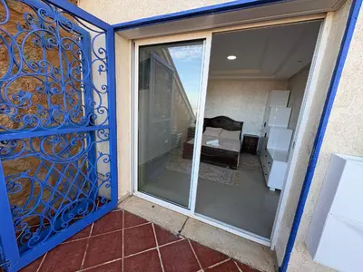 a sliding glass door with a view of a balcony at VILLA Dar BOUAZZA, Vue sur mer, 200m de la plage in Dar Bouazza