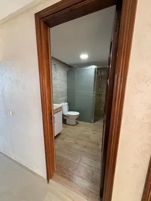 a bathroom with a toilet and a mirror at VILLA Dar BOUAZZA, Vue sur mer, 200m de la plage in Dar Bouazza