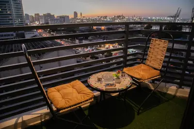 two chairs and a table on a balcony with a view at R109- Outstanding 1 BR Aprt with Great View in Casablanca