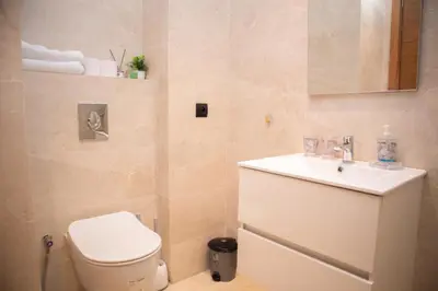 a bathroom with a toilet and a sink at R109- Outstanding 1 BR Aprt with Great View in Casablanca