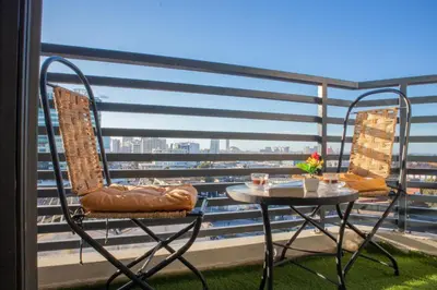 a table and chairs on a balcony with a view at R109- Outstanding 1 BR Aprt with Great View in Casablanca