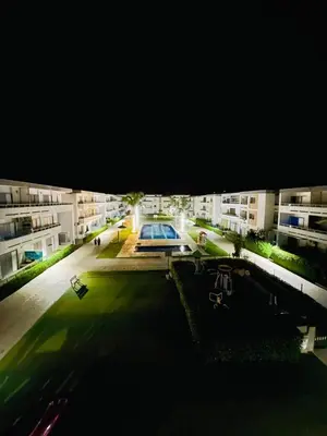 a view of a courtyard of a apartment building at well-equipped apartment in Mansouria