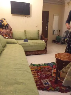 a living room with a couch and a flat screen tv at Younes Home in Casablanca