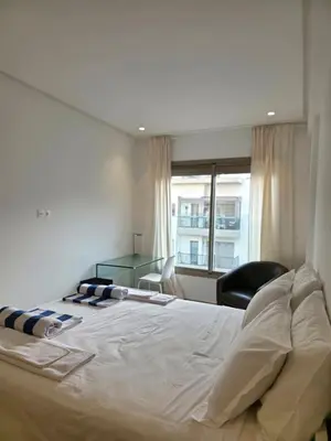 a large bed in a room with a window at super studio in Aïn Harrouda
