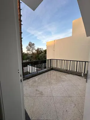 a balcony with a view of a building at Villa Val d'Or in Temara