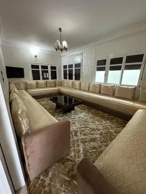 a large living room with a couch and a table at Villa Val d'Or in Temara