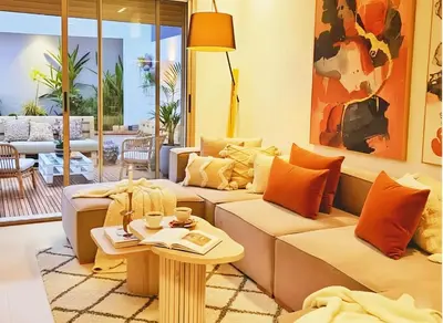 a living room with two couches and a table at Maya Suites - Oasis Casablanca in Casablanca