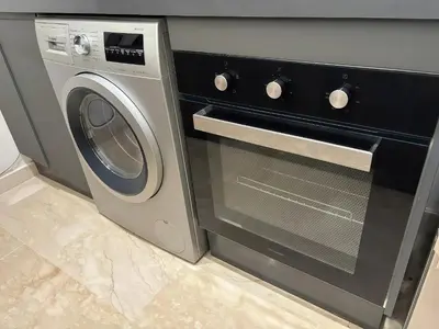 a washer and dryer in a kitchen at Maya Suites - Oasis Casablanca in Casablanca