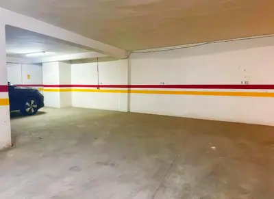 an empty garage with a car parked in it at Maya Suites - Oasis Casablanca in Casablanca