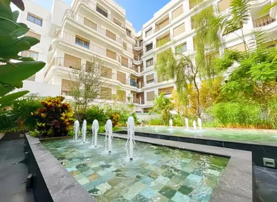 a fountain in the courtyard of a building at Maya Suites - Oasis Casablanca in Casablanca