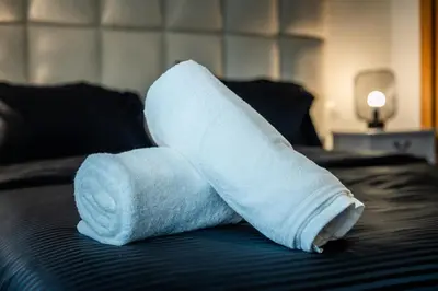 a roll of toilet paper sitting on a bed at C08- Anfa Place Luxury Apartment - Beach Access in Casablanca