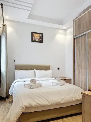 a bedroom with a bed with two towels on it at Appartement Typique Marocain in Oulad Akkou