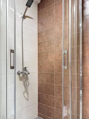 a bathroom with a shower with a shower head at Appartement Typique Marocain in Oulad Akkou