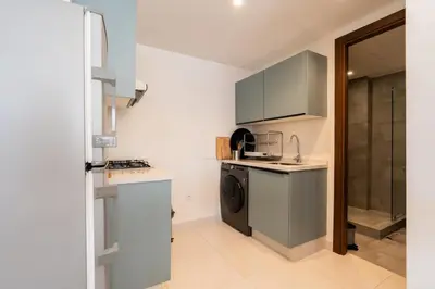 a small kitchen with a sink and a dishwasher at C14- 1BR Luxury Apartment -Terrace Majorelle in Casablanca