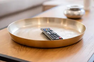 a remote control sitting in a bowl on a table at C14- 1BR Luxury Apartment -Terrace Majorelle in Casablanca