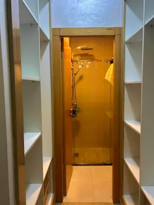 a walkin closet with a shower in it at Appartement chic a 5 mins de la plage in El Harhoura