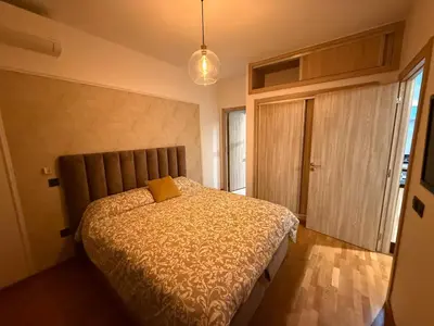 a bedroom with a bed with a yellow pillow on it at Marina, Medina et Bab Marrakech 8 min Hassan 2 in Casablanca