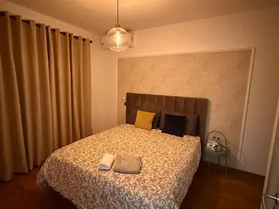 a bedroom with a bed with two pillows on it at Marina, Medina et Bab Marrakech 8 min Hassan 2 in Casablanca