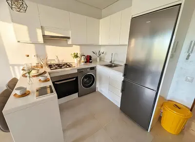 a kitchen with a stainless steel refrigerator at Maya Suites - Riviera B Casablanca in Casablanca