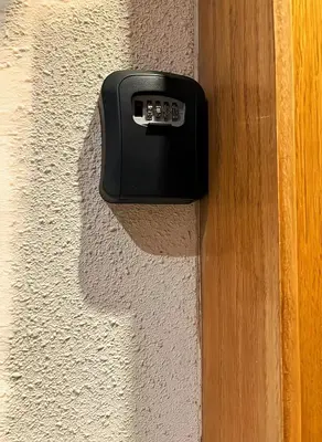 a black door sensor on the side of a wall at Maya Suites - Riviera B Casablanca in Casablanca