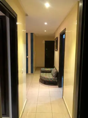 a hallway with a couch in a room at Central Casablanca Apartment Steps from Hassan II Area in Casablanca