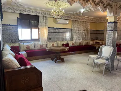 a living room with a couch and a table at Naima in Rabat