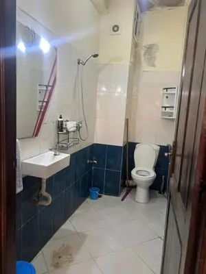 a bathroom with a toilet and a sink at Naima in Rabat