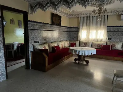 a living room with a couch and a table at Naima in Rabat