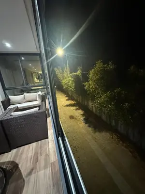 a view of a window with a couch on a train at Appartement à louer Eden Mansouria Residence in Mansouria