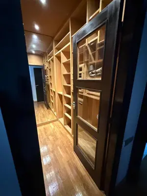 an empty closet with a door and wooden floors at Apartment luxurious a Hay Riad in Rabat