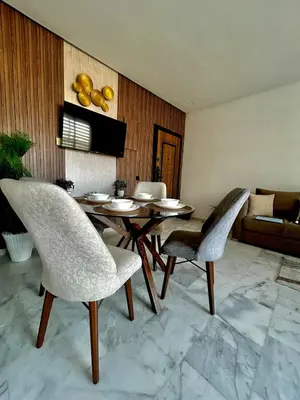 a dining room with a table and chairs at Chic Cocoon & Impeccable Sea View in Zenata in Aïn Harrouda