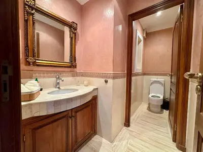 a bathroom with a sink and a toilet at Luxurious Ocean View Villa Ain Diab in Casablanca