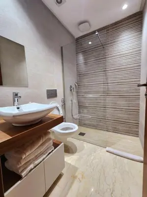 a bathroom with a sink and a toilet and a shower at Oasis de Sérénité avec Piscine in Casablanca