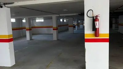 an empty parking garage with a fire hydrant on a pole at Cosy-Piscine-Parking in Casablanca