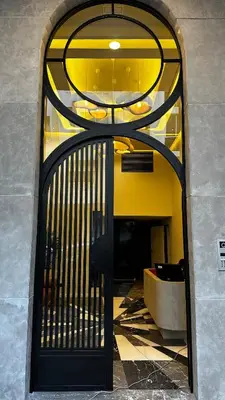 a black gate in front of a building at studio luxe rooftop & gym quartier des princess in Casablanca