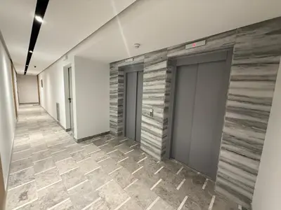 a hallway with two doors and a tile floor at Elegant Business Stay in Downtown Casablanca in Casablanca